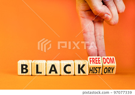 Black history and freedom symbol. Concept words Black history Black freedom on wooden cubes. Businessman hand. Beautiful orange table orange background. Black history and freedom concept. Copy space. Black history and freedom symbol. Concept words Black history Black freedom on wooden cubes. Businessman hand. Beautiful orange table orange background. Black history and freedom concept. Copy space. 97077339