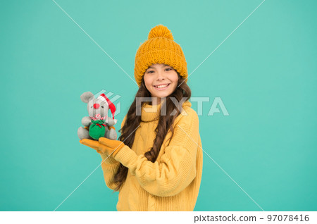 Plush toy. 2020 rat year. It has characteristics of animal with spirit wit alertness delicacy flexibility and vitality. Girl child hold rat or mouse toy. Chinese horoscope concept. Rat symbol year 97078416