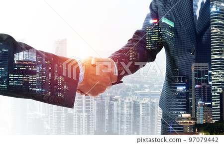 Close-up of the handshake of businessmen. Close-up of the handshake of businessmen. 97079442