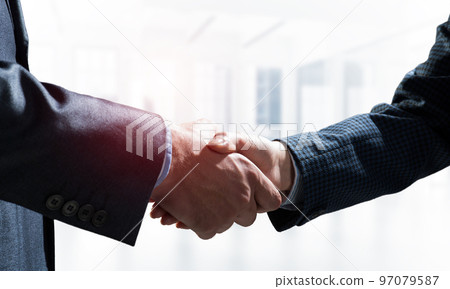Close-up of the handshake of businessmen. Close-up of the handshake of businessmen. 97079587