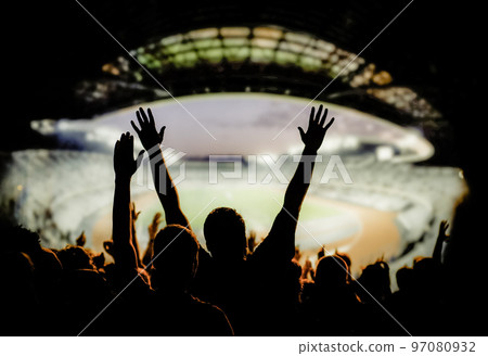 football or soccer fans at a game in a stadium world cup 97080932