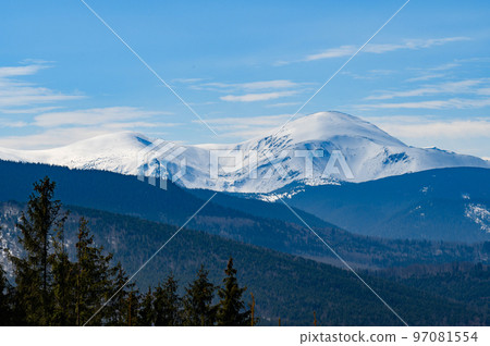 Wonderful views of the Carpathian Mountains covered with snow and a clear blue sky in Ukraine. Wonderful views of the Carpathian Mountains covered with snow and a clear blue sky in Ukraine. 97081554