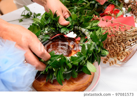 The process of weaving a periwinkle wreath, which is a traditional Ukrainian talisman for Ukrainian brides. 97081573