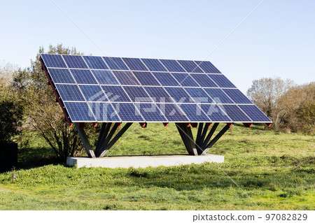 Solar panels installed on a metal built structure in a field 97082829