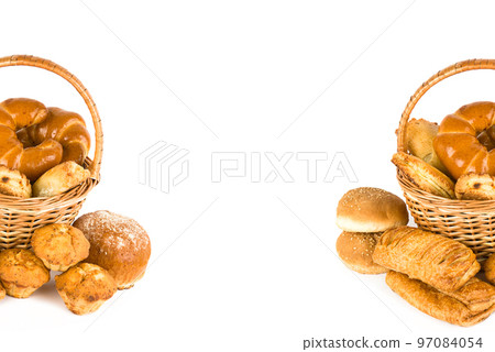 Sweet pastries in a basket isolated on a white . Free space for text. 97084054