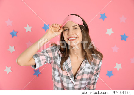 Woman with feather showing smooth skin after bikini epilation on pink background Woman with feather showing smooth skin after bikini epilation on pink background 97084134