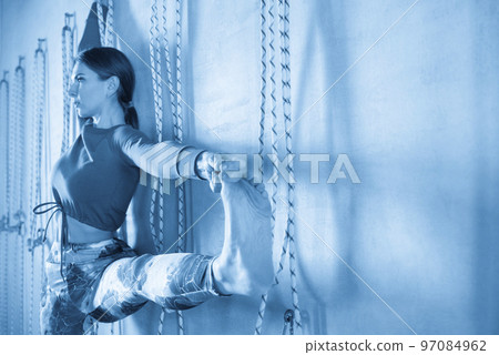 Portrait of a beautiful young woman in yoga pose 97084962