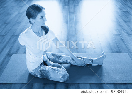 woman stretching on mat in gym, fitness, sport, training and lifestyle concept 97084963