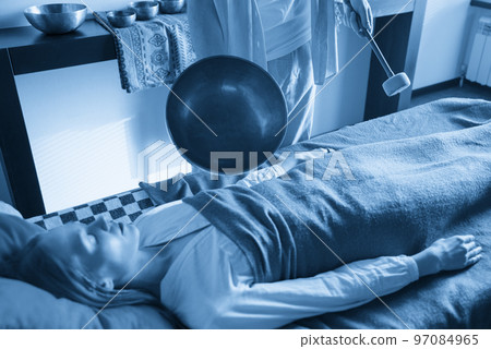 Tibetan singing bowls in sound therapy in spa center Tibetan singing bowls in sound therapy in spa center 97084965