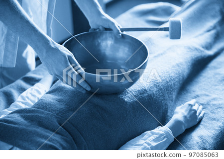 Tibetan singing bowls in sound therapy in spa center 97085063