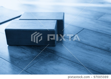 Closeup of wooden blocks yoga equipment in studio Closeup of wooden blocks yoga equipment in studio 97085089