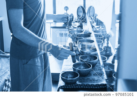 Tibetan singing bowls in sound therapy in spa center 97085101