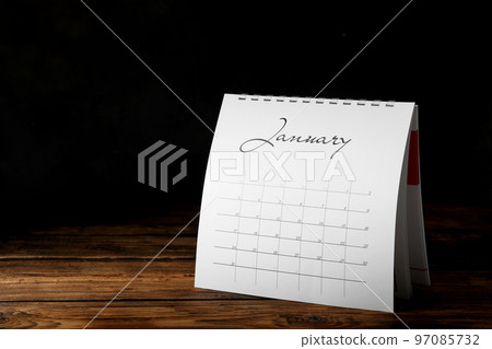 Paper calendar on wooden table, space for text. Planning concept Paper calendar on wooden table, space for text. Planning concept 97085732