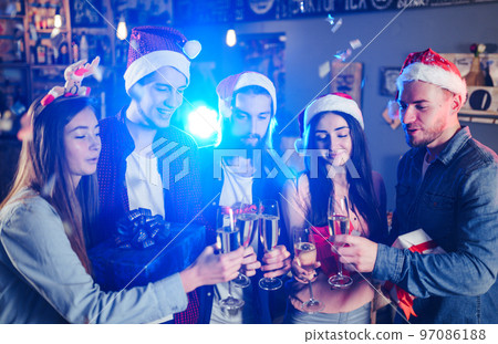 Friends celebrating new year's together. Portrait of Friends With Drinks Enjoying Cocktail Party. Friends celebrating new year's together. Portrait of Friends With Drinks Enjoying Cocktail Party. 97086188