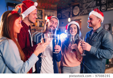 Friends celebrating new year's together. Portrait of Friends With Drinks Enjoying Cocktail Party. Friends celebrating new year's together. Portrait of Friends With Drinks Enjoying Cocktail Party. 97086191
