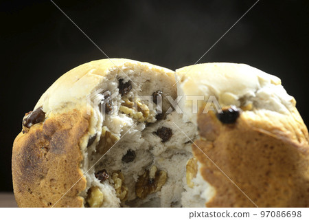 Freshly baked raisin and walnut bread 97086698
