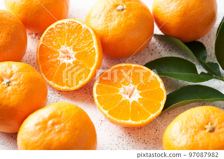 Mandarin oranges cut in half Mandarin oranges cut in half 97087982