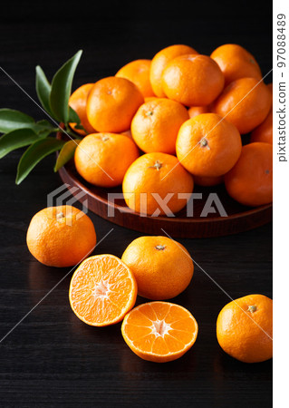 Mandarin oranges cut in half 97088489