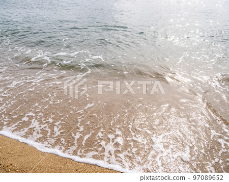 Waves on the sandy beach. Waves on the sandy beach. 97089652