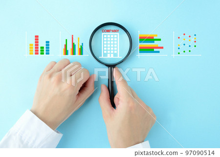 Hands of a person who conducts company research and analyzes company information Hands of a person who conducts company research and analyzes company information 97090514