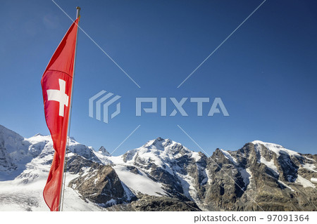 Swiss flag and Bernina mountain range with glaciers in the Alps, Switzerland 97091364