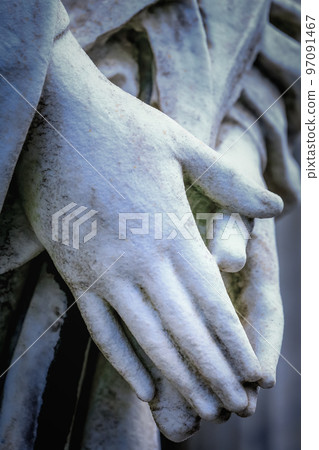 Faithfull Virgin Mary with praying hands and blessing, looking at the sky 97091467