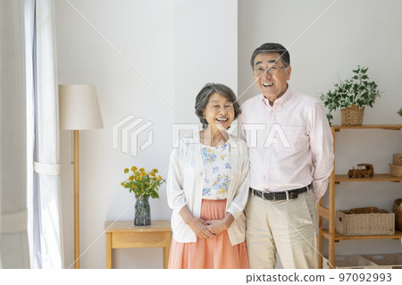 A couple in their late 70s looking at the camera Portrait 97092993