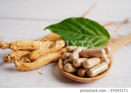 Ginseng roots and green leaf, healthy food. 97093371