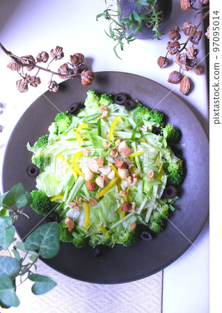 Lettuce and broccoli salad served on a black plate Lettuce and broccoli salad served on a black plate 97095014