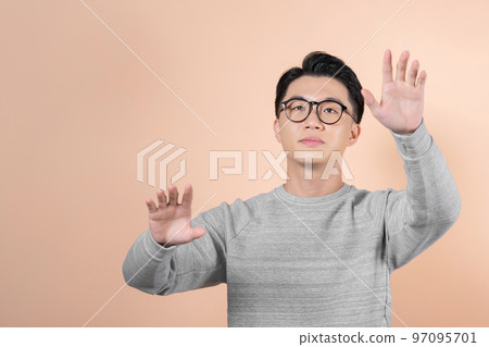 Asian man with the camera facing the palm, touching an interactive virtual screen Asian man with the camera facing the palm, touching an interactive virtual screen 97095701