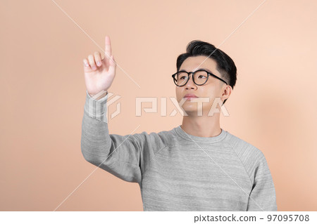 Businessman pressing an imaginary button Businessman pressing an imaginary button 97095708