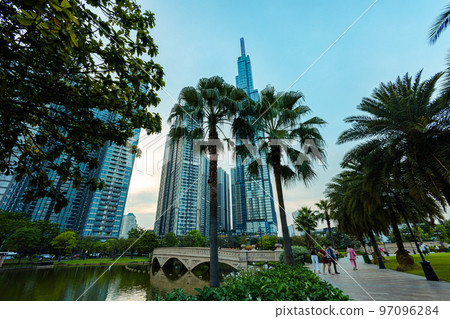 Ho Chi Minh City, Vietnam - November 08, 2022: Night view to the Saigon icon, the landmark 81. The sunset falls at landmark 81, the tallest building in Vietnam. View from central park to the new tower 97096284