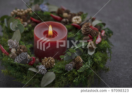 Christmas wreath and candle black background 97098323