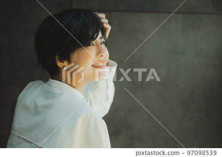A woman with a white shirt A woman with a white shirt 97098539