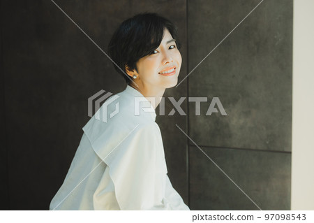 A woman with a white shirt A woman with a white shirt 97098543