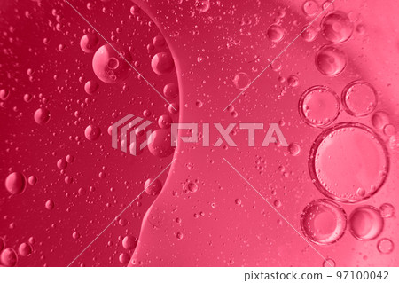 abstract light viva magenta background with oil circles . bubbles of water close up 97100042