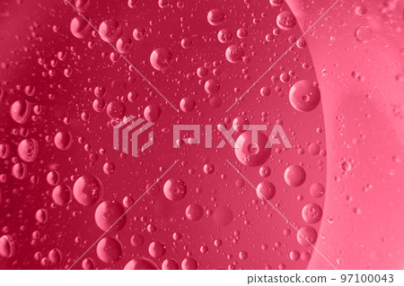 abstract light viva magenta background with oil circles . bubbles of water close up 97100043