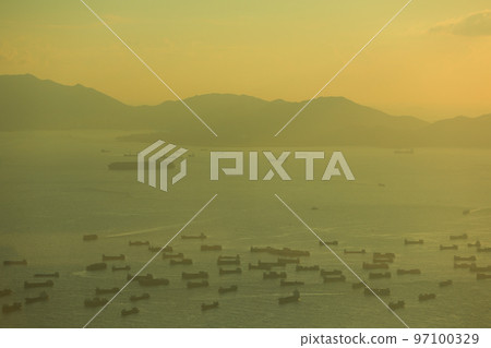 Sea port at scenic sunset in West Kowloon, Hong Kong 2 July 2012 Sea port at scenic sunset in West Kowloon, Hong Kong 2 July 2012 97100329