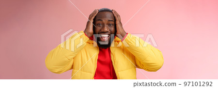 Happy surprised pleased young african-american 25s man young jacket red hoodie smiling amused, astonished smiling receiving awesome gift holding hands head thrilled, standing pink background Happy surprised pleased young african-american 25s man young jacket red hoodie smiling amused, astonished smiling receiving awesome gift holding hands head thrilled, standing pink background 97101292