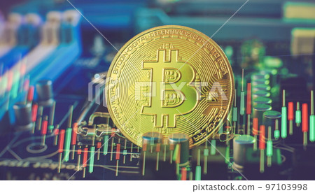 Cryptocurrency concept , Golden bitcoin on winners cup background mainboard , The future of money. Computational equipment. 97103998