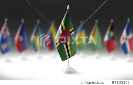 The national flag of the Dominica on the background of flags of other countries 97105361