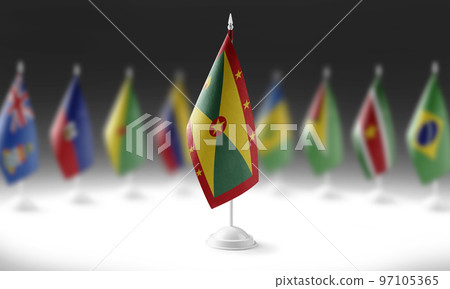 The national flag of the Grenada on the background of flags of other countries The national flag of the Grenada on the background of flags of other countries 97105365