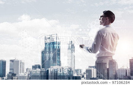 Concept of business success and control with confident boss against cityscape background 97106284