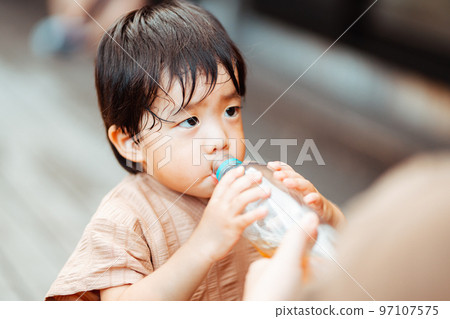 2-year-old boy drinking barley tea 2-year-old boy drinking barley tea 97107575