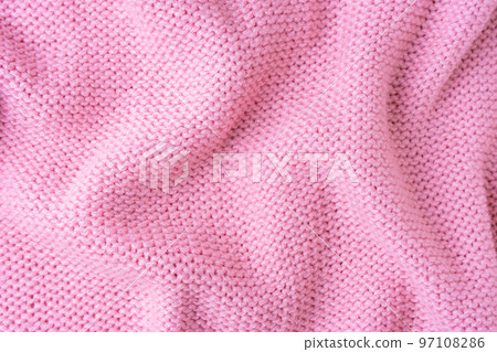Pastel pink knitwear wool fabric texture background. Abstract textile backdrop 97108286