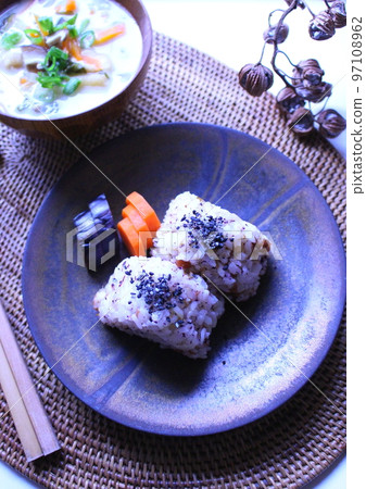 Onigiri, pickles and soup served on a Japanese-style plate Onigiri, pickles and soup served on a Japanese-style plate 97108962