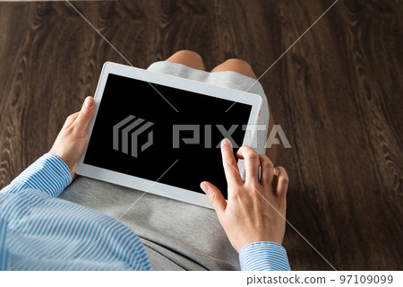 business woman with tablet on her lap business woman with tablet on her lap 97109099