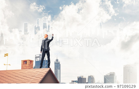 Man architect draw silhouette of modern city on blue sky. Mixed Man architect draw silhouette of modern city on blue sky. Mixed 97109129