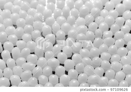 Close up picture of polyamide granules, selective focus. 97109626