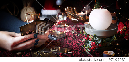 Tarot reader or Fortune teller reading on Christmas decoration. Tarot reader or Fortune teller reading on Christmas decoration. 97109681